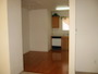 As you enter the dining area, you see the kitchen.