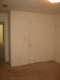 A view of the master bedroom to the closed closet door.