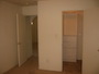 Another view of the master bedroom to the closet (right) and entry-way to the living room.