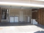 Two-car garage with the washer/dryer immediately to the left of the door that enters into the kitchen,