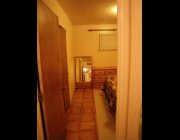 Larger bedroom from hallway
